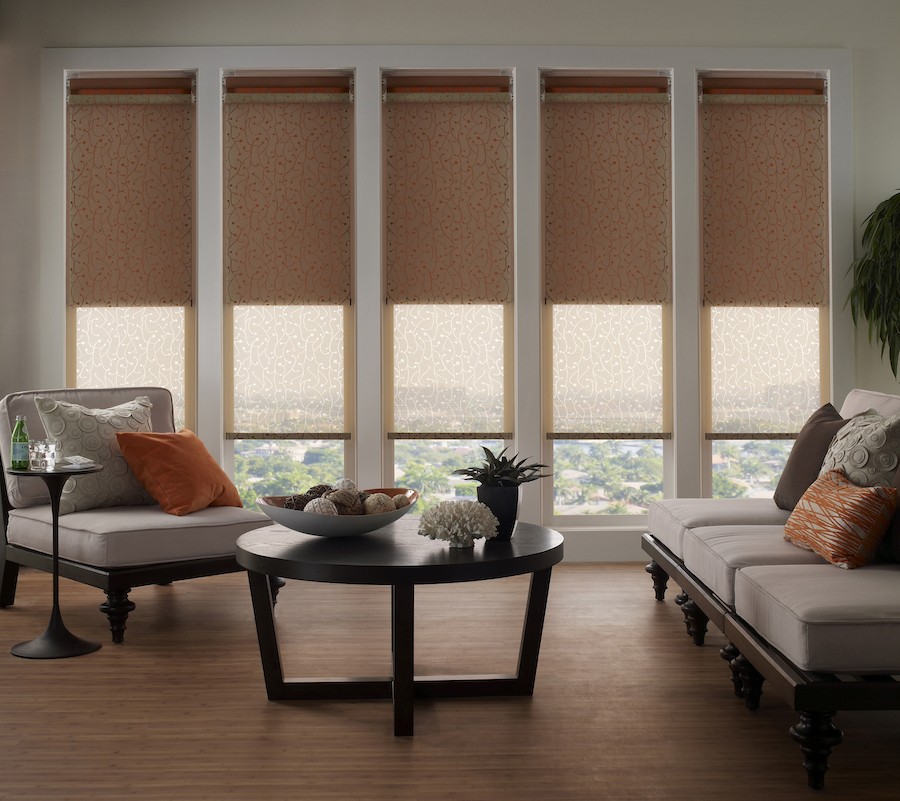 A living room equipped with layered Lutron motorized shades.